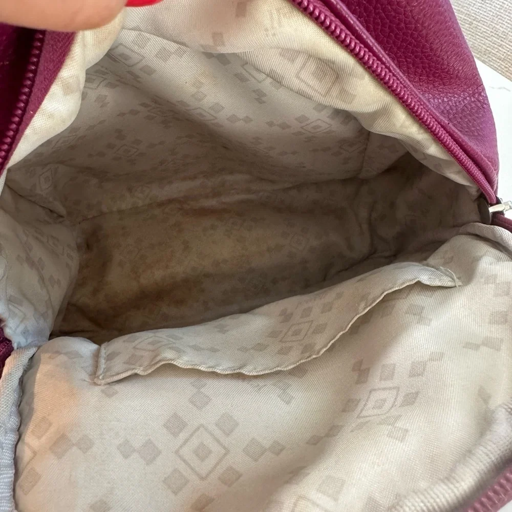 Jewell small backpack purse.  Purple in color. Good used condition.